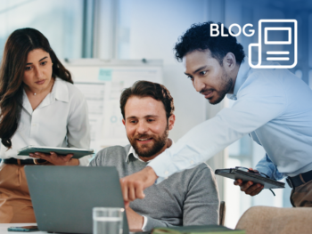 Blog-7-things-about-CHL - CHL Mortgages for Intermediaries Three colleagues crowd around a laptop computer at the office while one points at the screen, a blog icon overlays the image